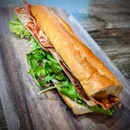 Bánh mì SGV chay với pate chay, sốt tỏi aioli, thịt xông khói chay và đồ chua tại Saigon Vegan, Garden Grove, CA