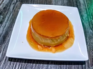 Slice of silky vegan coconut caramel flan at Saigon Vegan in Garden Grove, CA